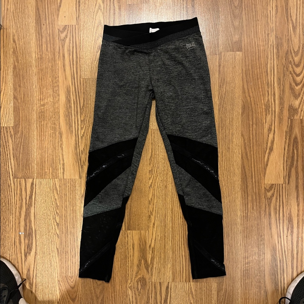 Gray crossover leggings with mesh on bottom part of legs